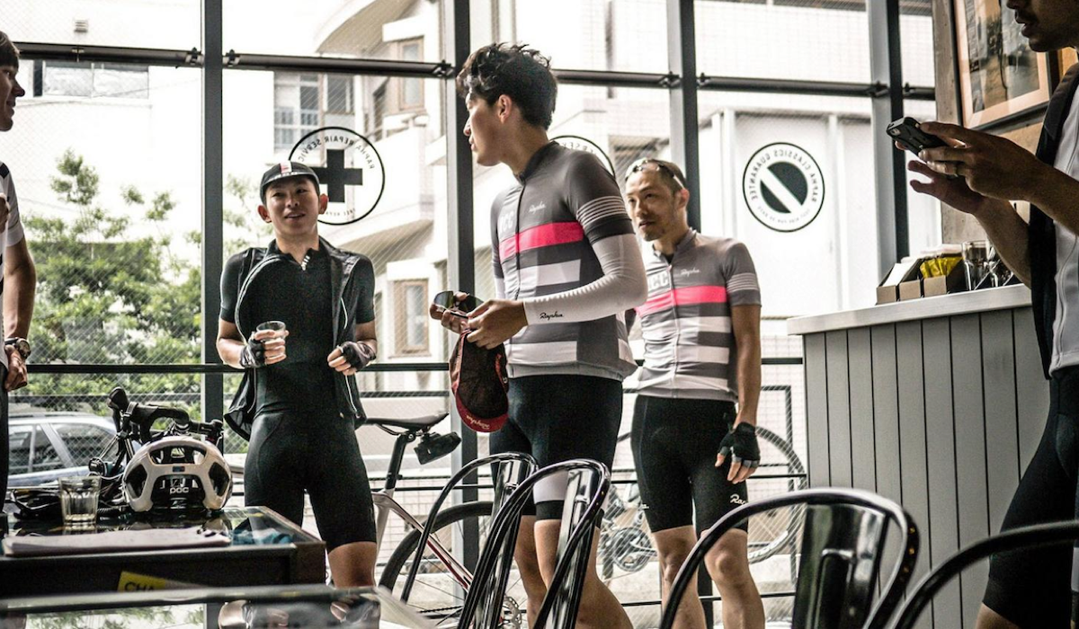 Rapha Cyclists drinking coffee in cafe